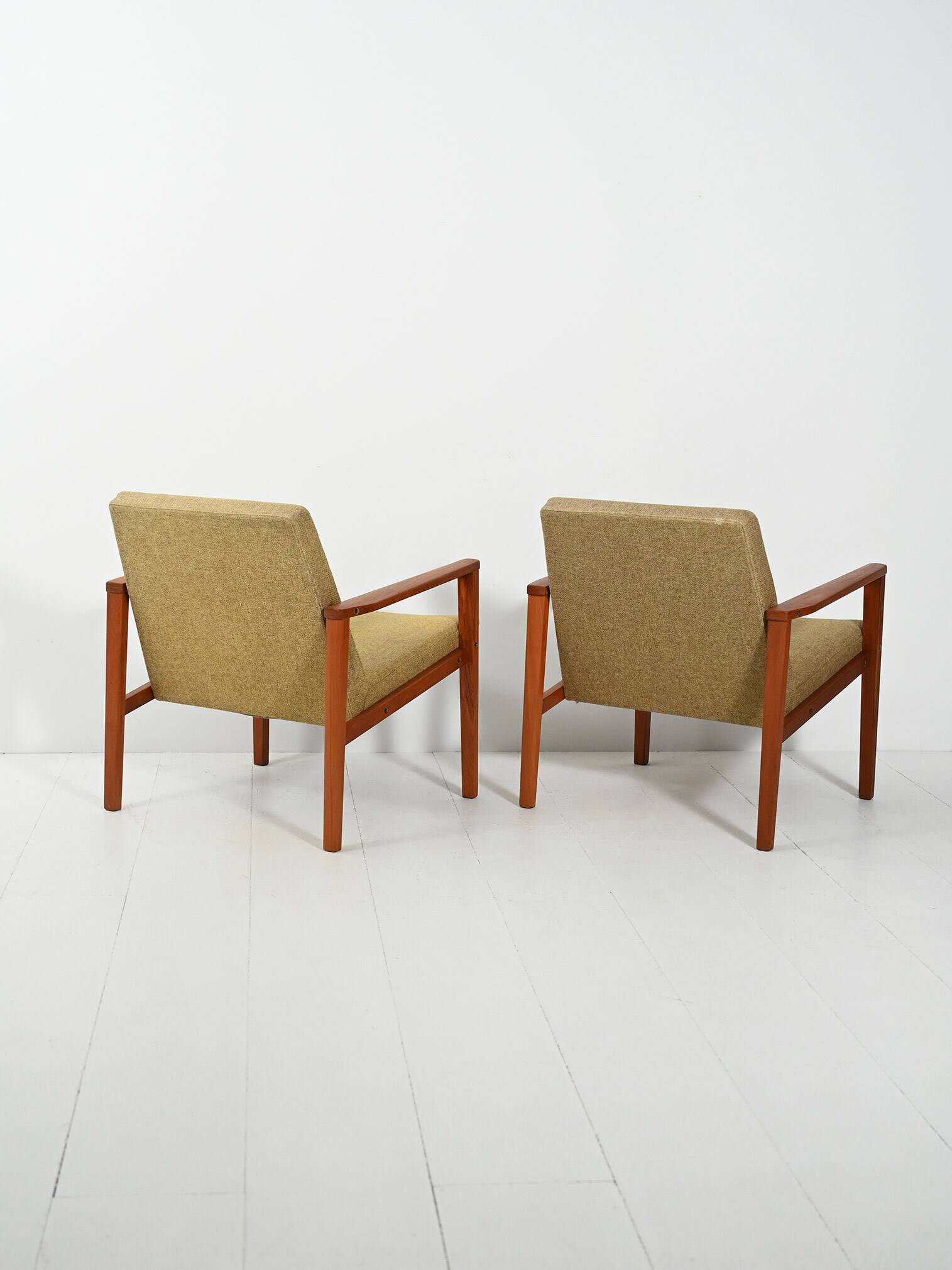 Pair of Danish teak armchairs with green upholstery