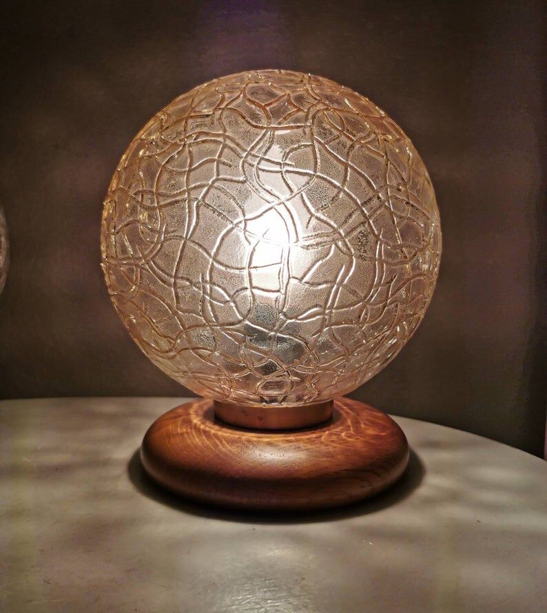 Wooden table lights with 70s gold glass hood