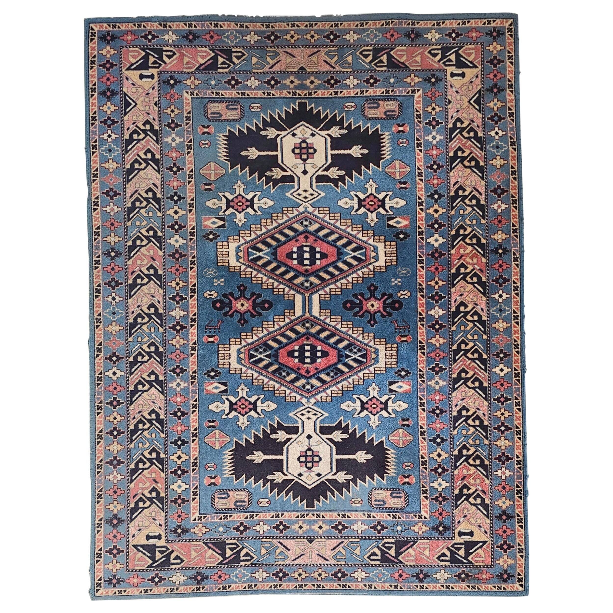 Vintage Kazak rug with geometric oriental motifs, 100% wool.