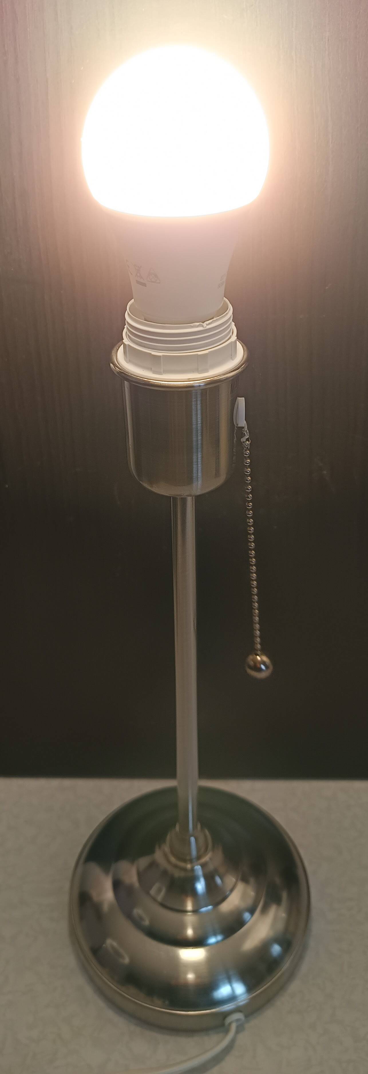Modern white nickel lamp base with pull switch.