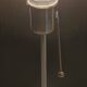 Modern white nickel lamp base with pull switch.