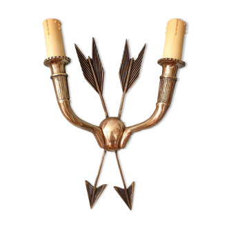 Vintage wall lamp decorated with bronze arrows