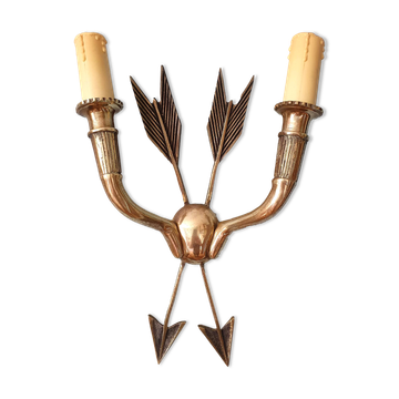 Vintage wall lamp decorated with bronze arrows