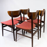 Set of four dining room chairs in rosewood and upholstered with red fabric, of danish design, 1960s