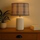 White ceramic lamp with tartan shade – cozy and timeless style