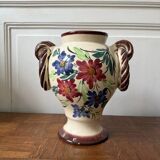 Ceramic vase with hand-painted floral decoration.
