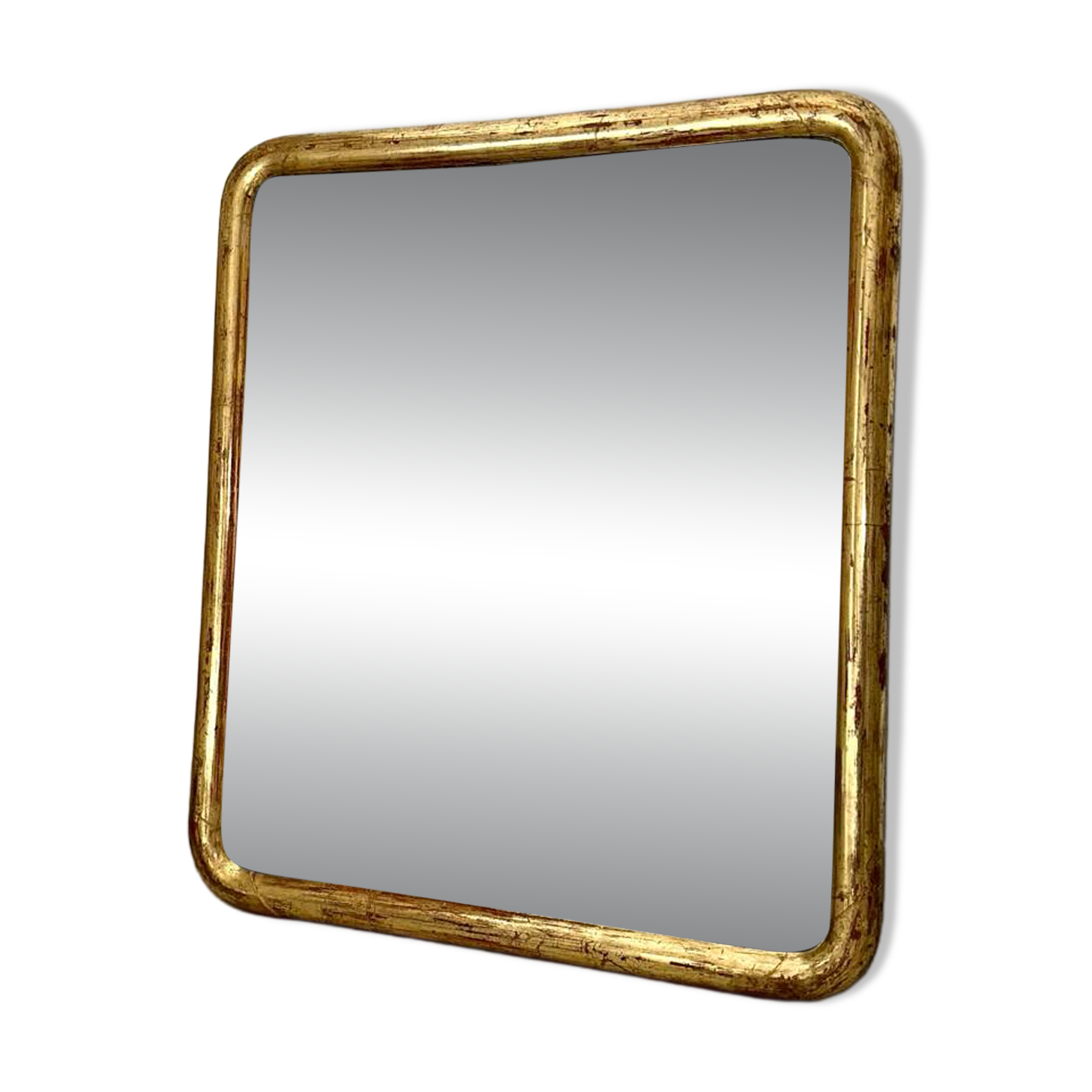 Antique gilded Louis-Philippe mirror, 19th century.