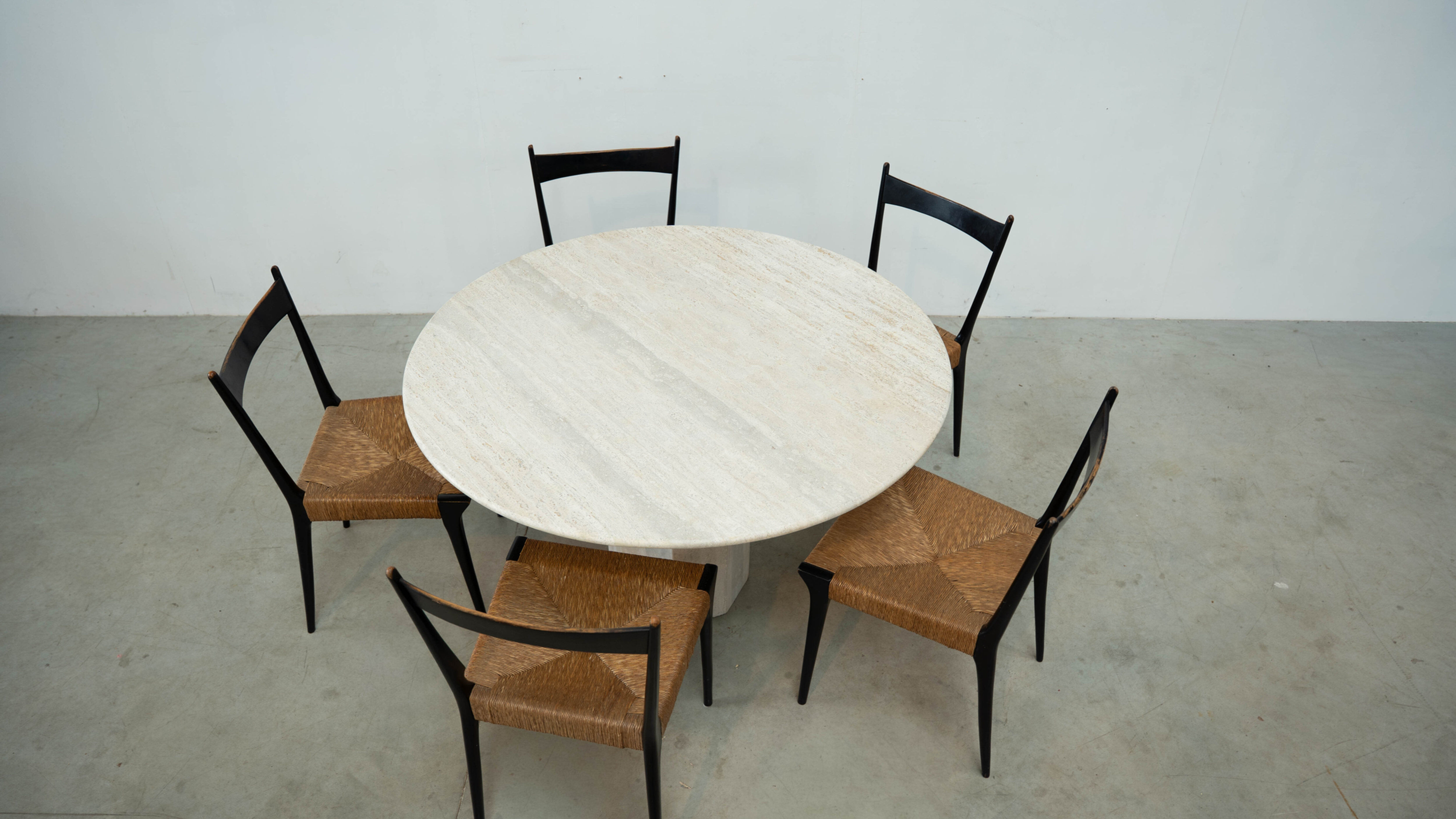 Round Belgian travertine dining table