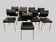 Suite de neuf chaises vintage en chrome et similicuir XX siècle