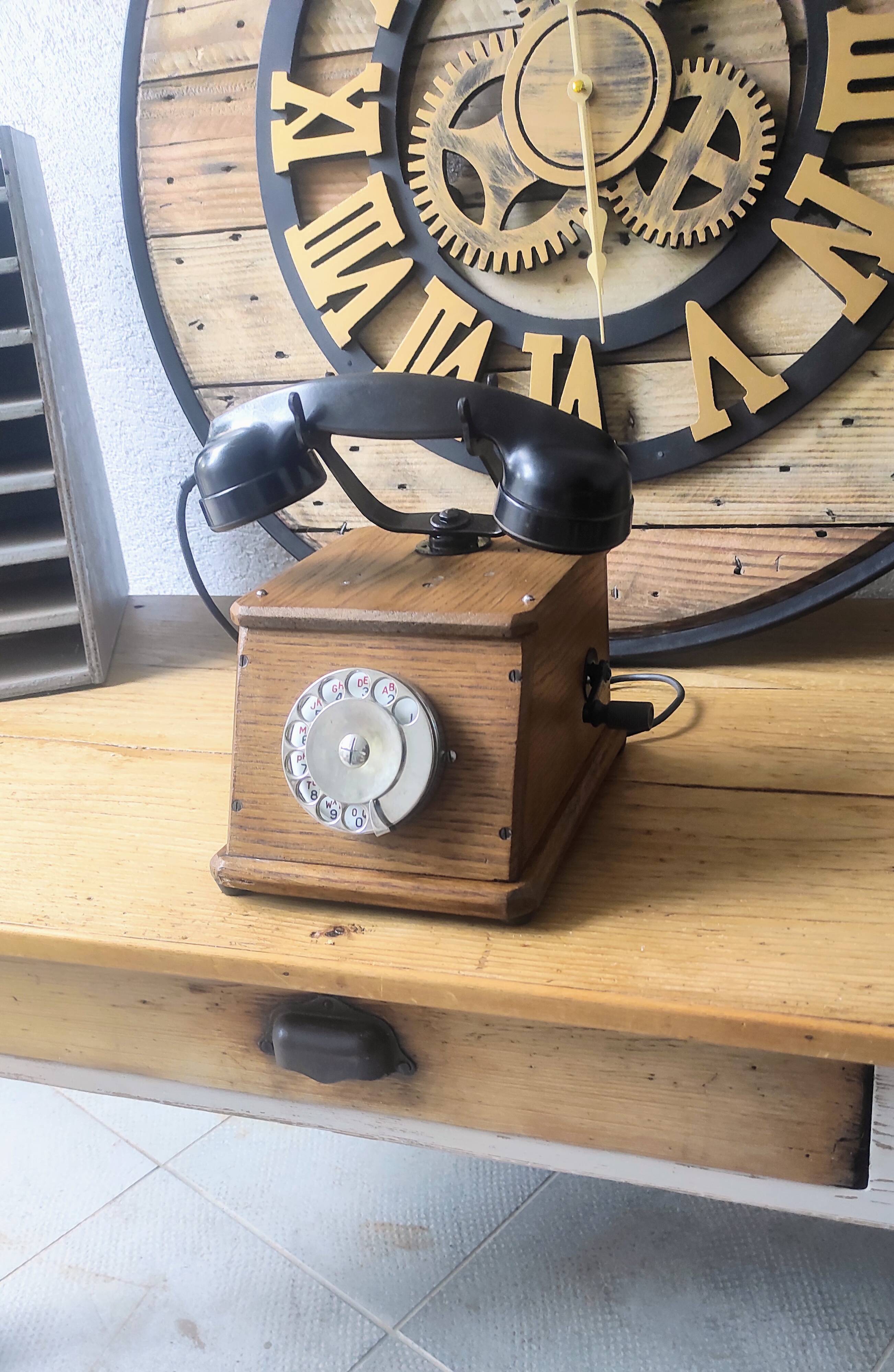 Old wooden dial crank telephone