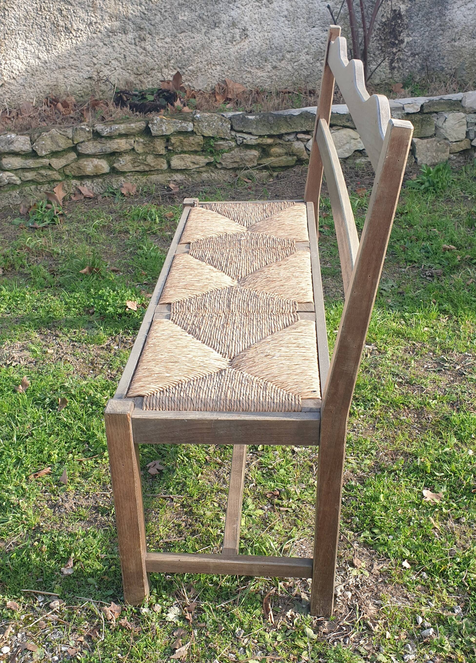 Wooden bench with vintage straw seating
