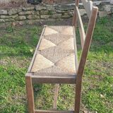 Wooden bench with vintage straw seating