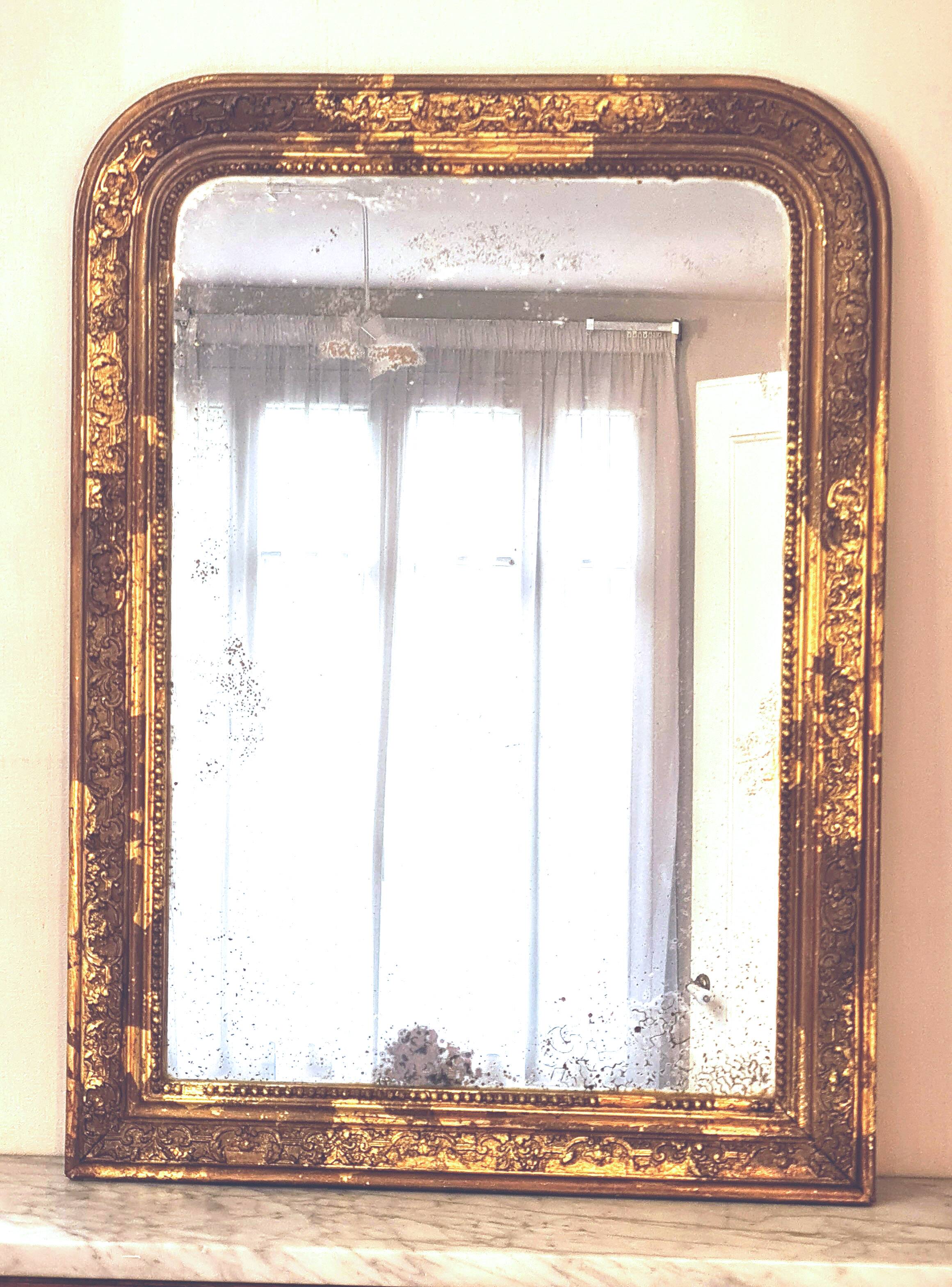 Old Louis Phillipe mercury mirror, in gilded stucco.