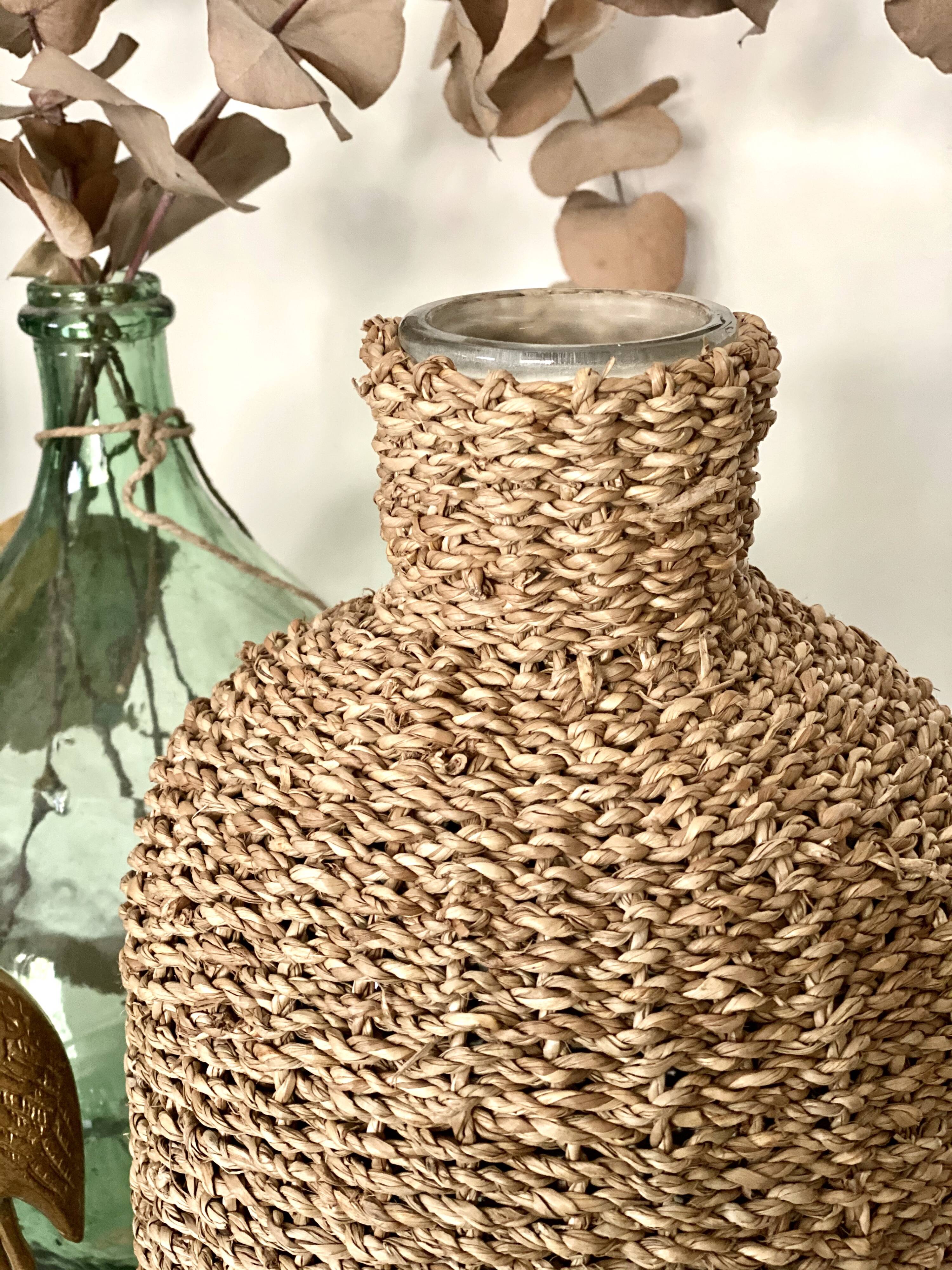 Glass bottle and braided rope