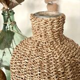 Glass bottle and braided rope