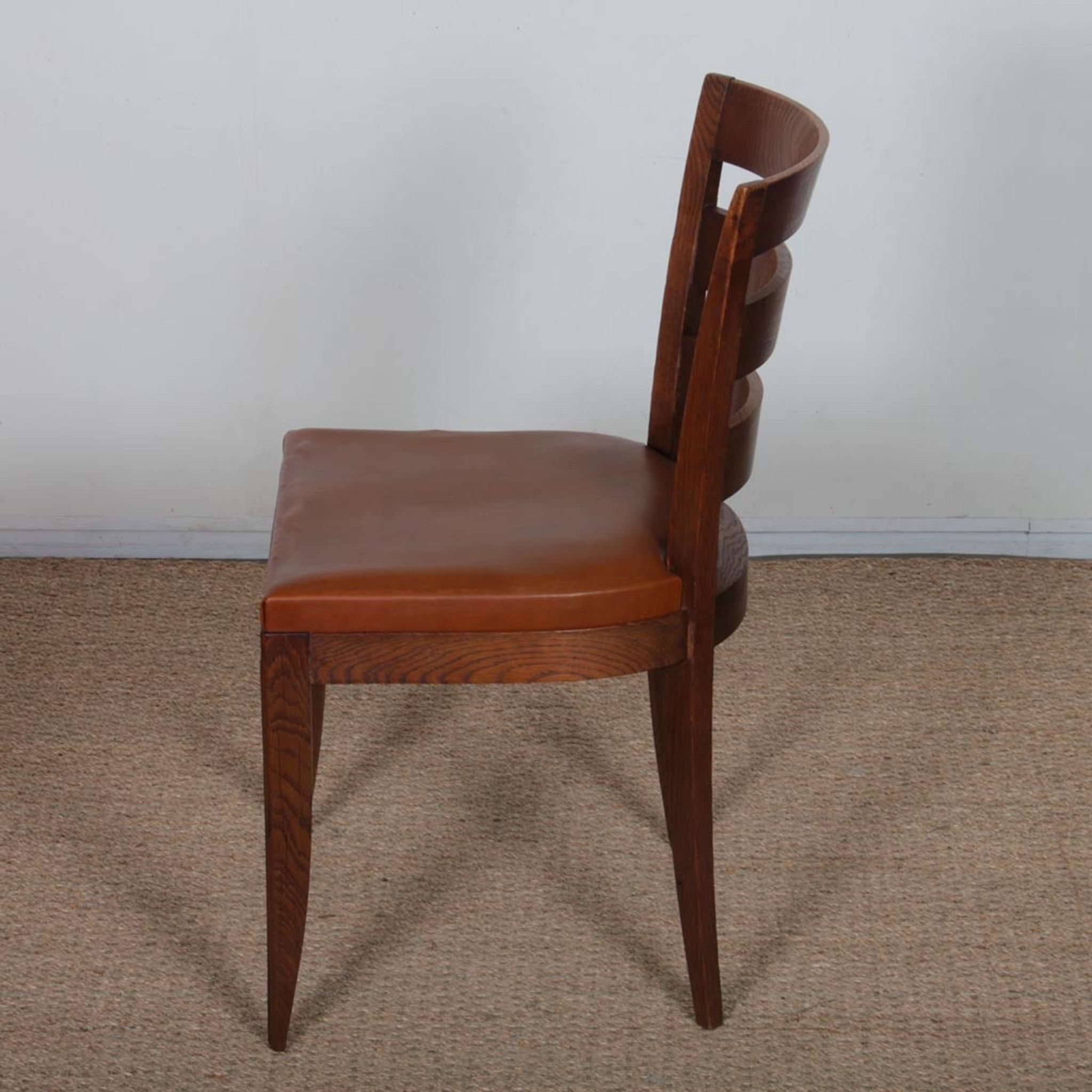 Set of 6 oak chairs in the style of Jean Pascaud, 1940.