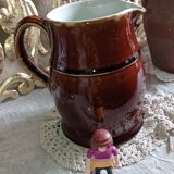 Set of three glazed stoneware pitchers