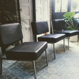 3 black armchairs