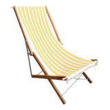 Vintage folding deckchair with yellow striped canvas