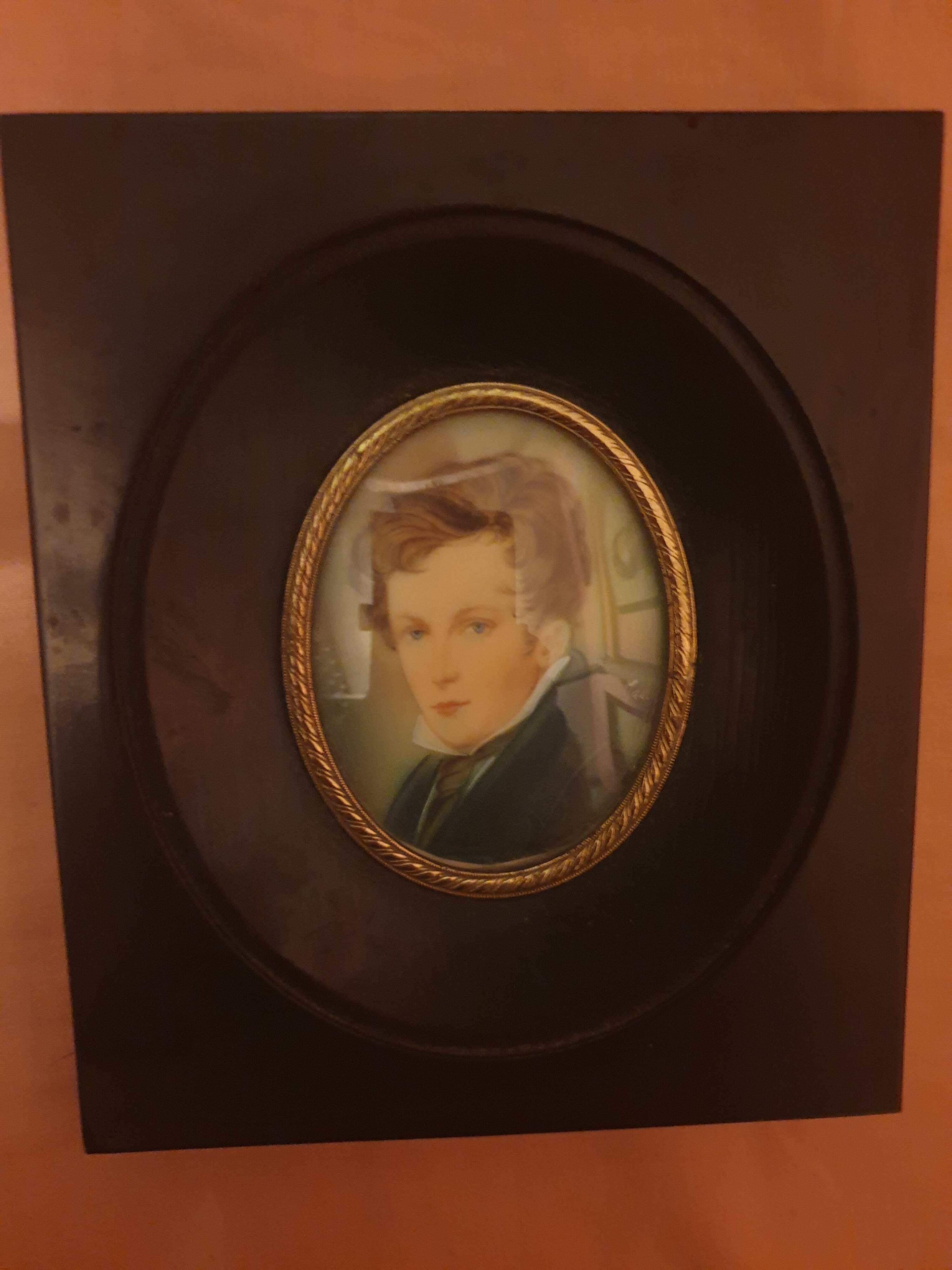 Miniature portrait of a man in a wooden frame