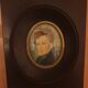 Miniature portrait of a man in a wooden frame