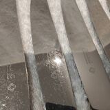 12 silver-plated table knives, Christofle goldsmith ribbons