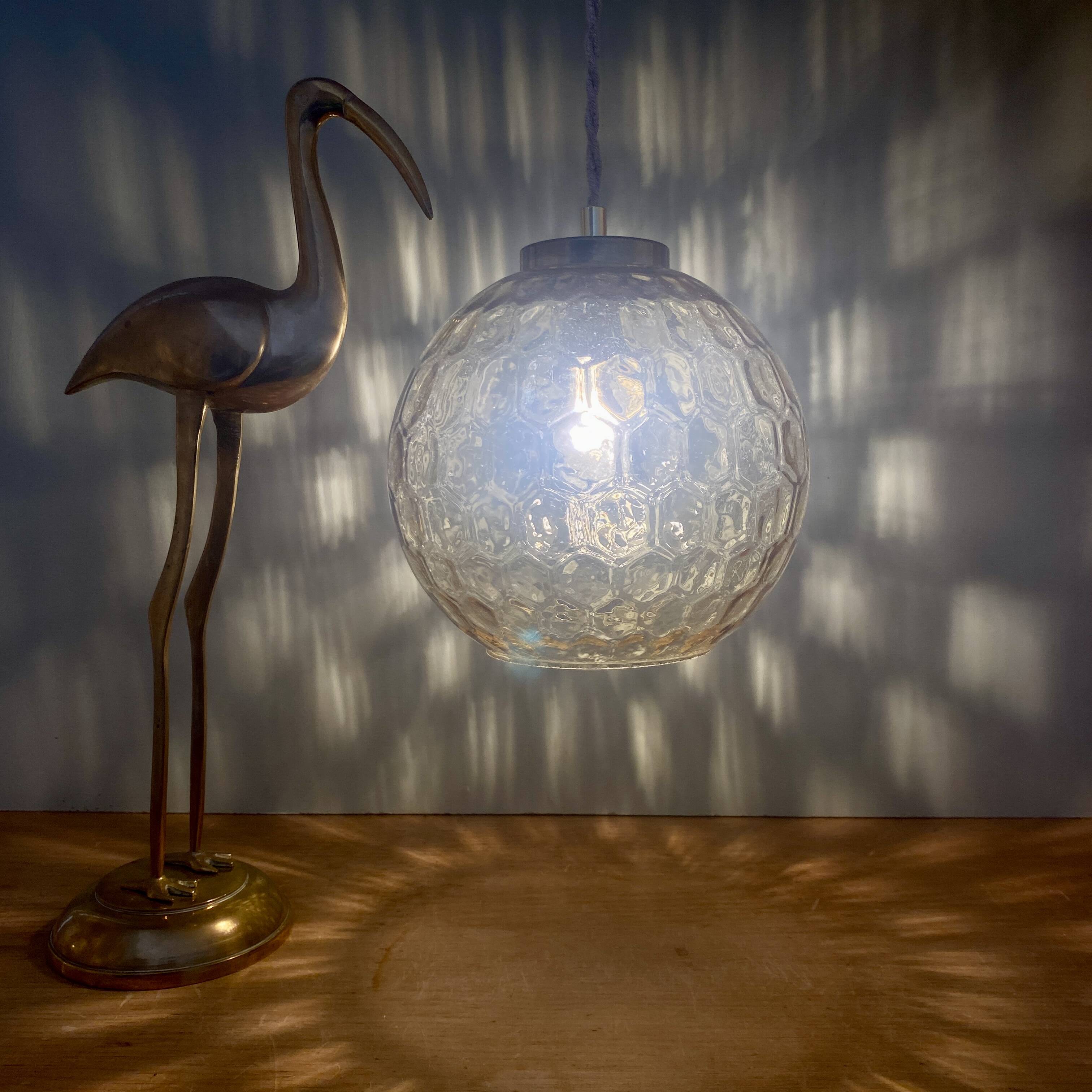 Vintage globe pendant light in amber glass