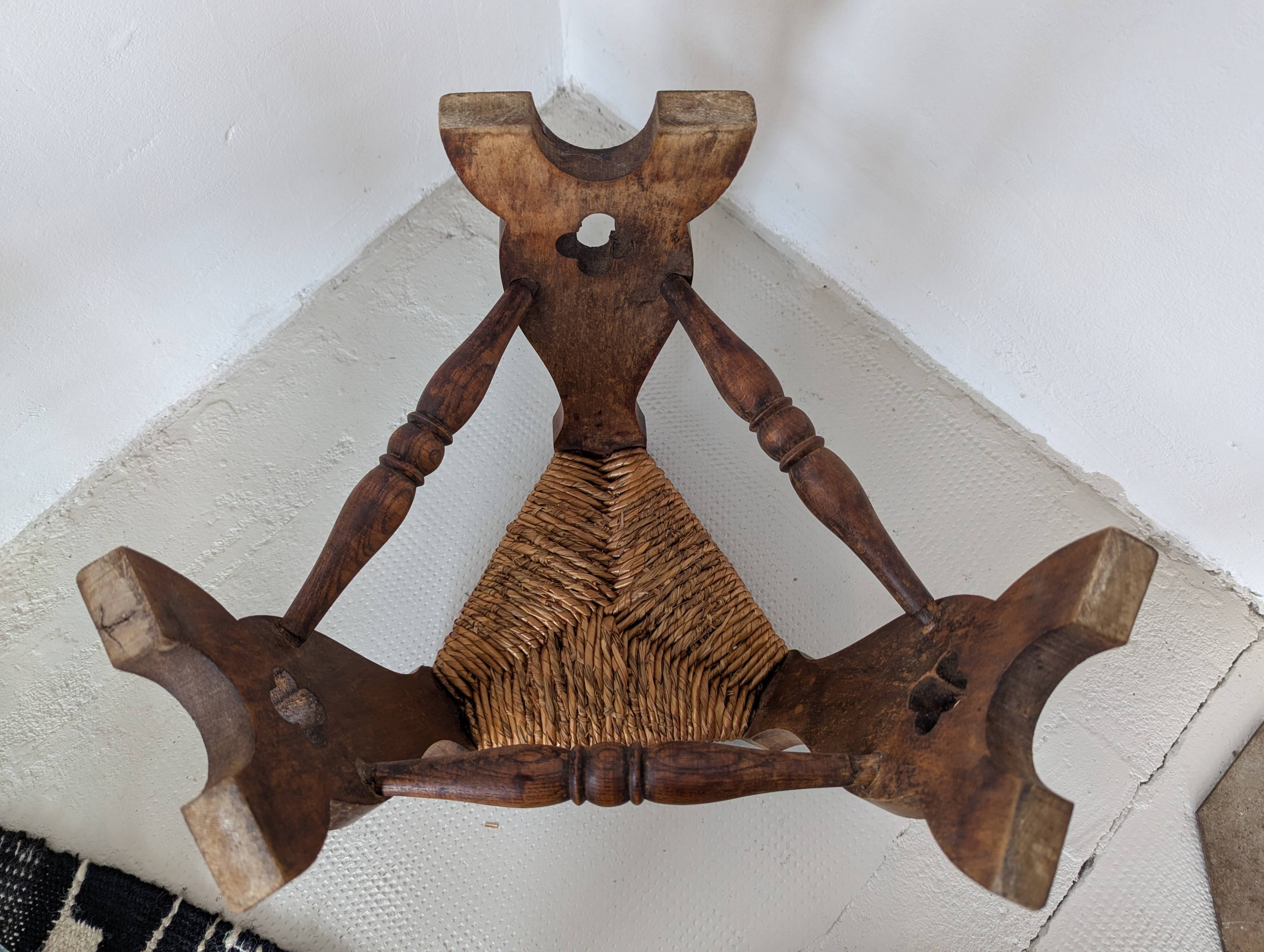 Low tripod farm stool in wood and straw