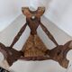 Low tripod farm stool in wood and straw
