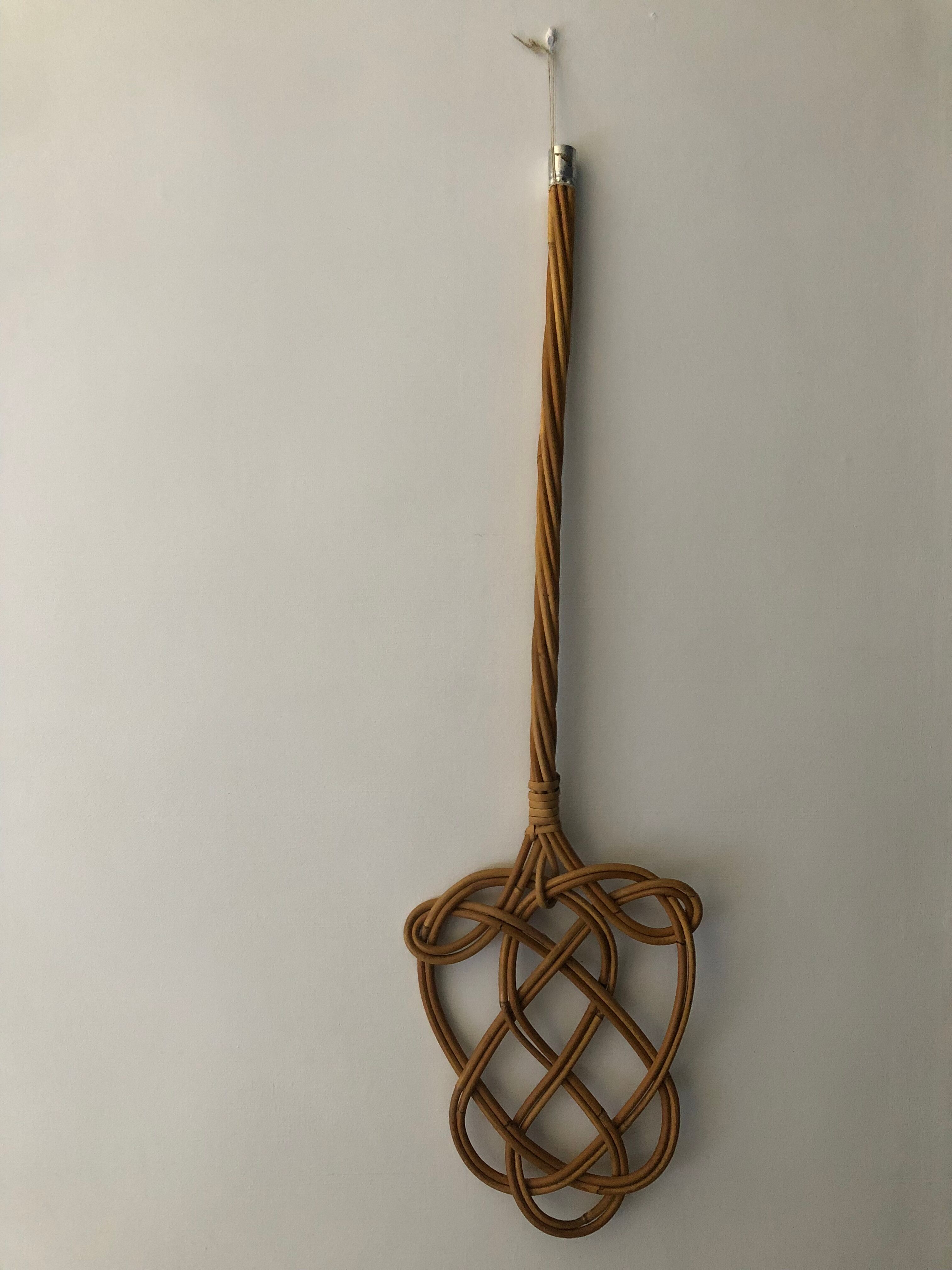 Braided wicker carpet beater