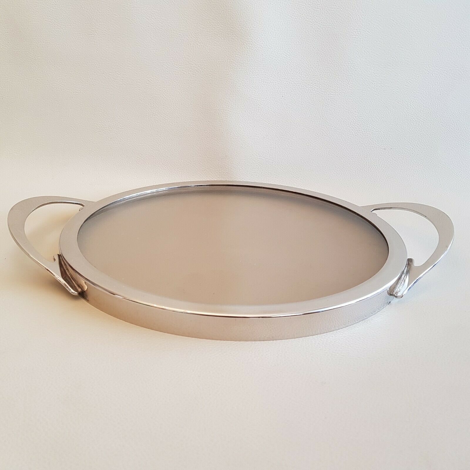 Round glass and art deco silver metal tray