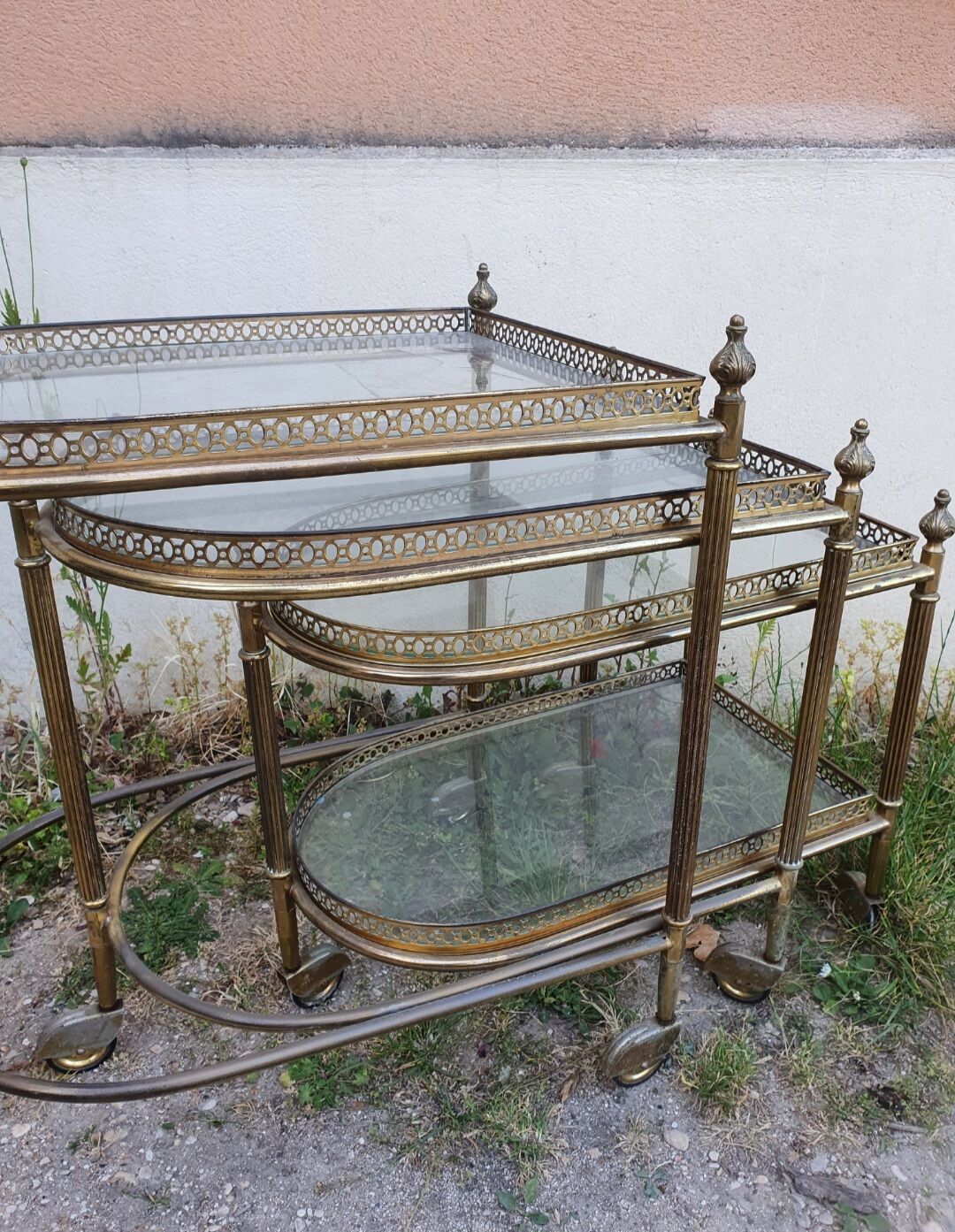 Set of nesting brass and glass serving trolleys