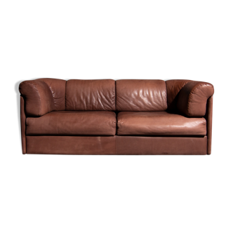 Vintage two seater upholstered with brown sanded leather