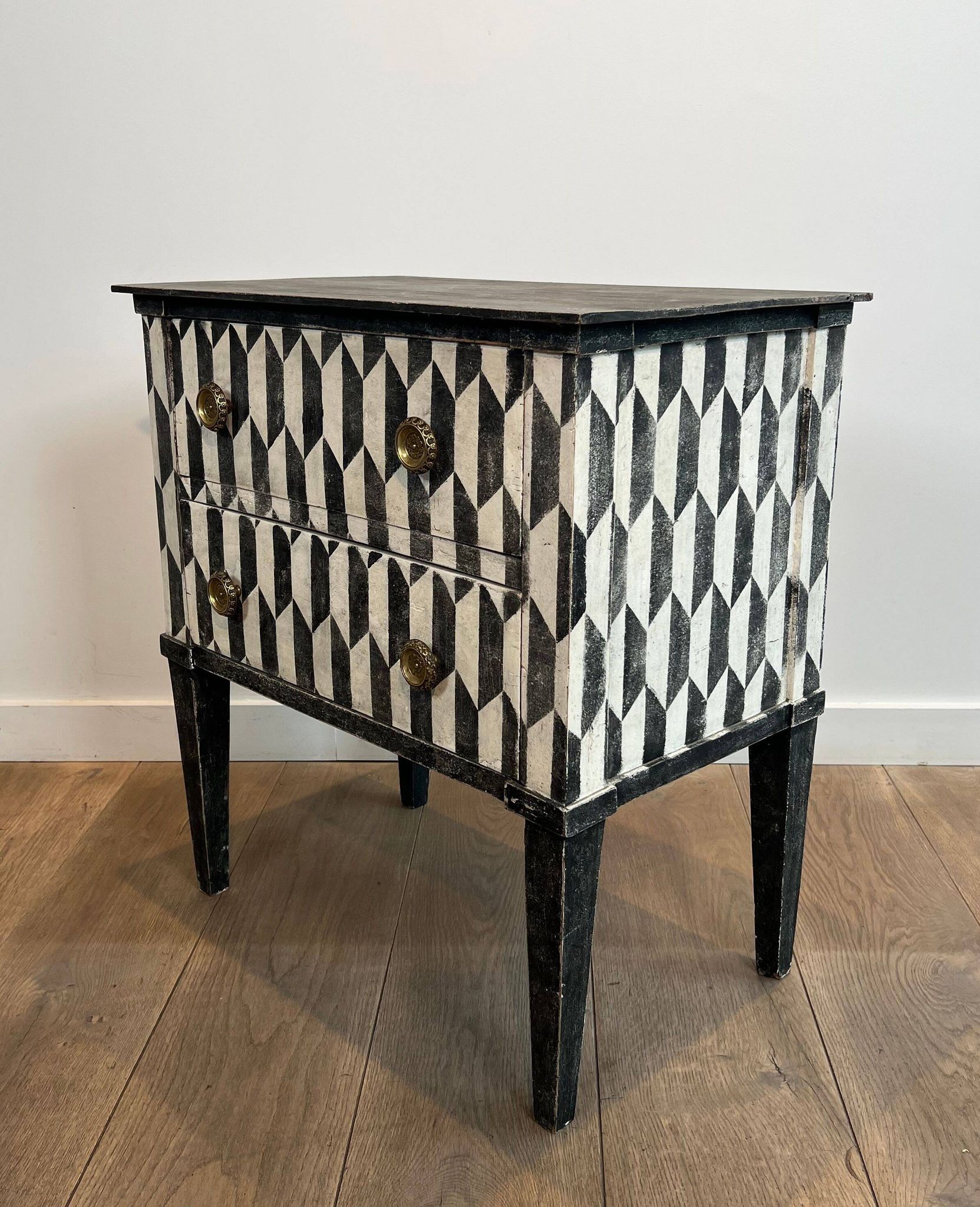 Small Italian chest of drawers with two drawers, patinated with a trompe-l'œil checkerboard pattern
