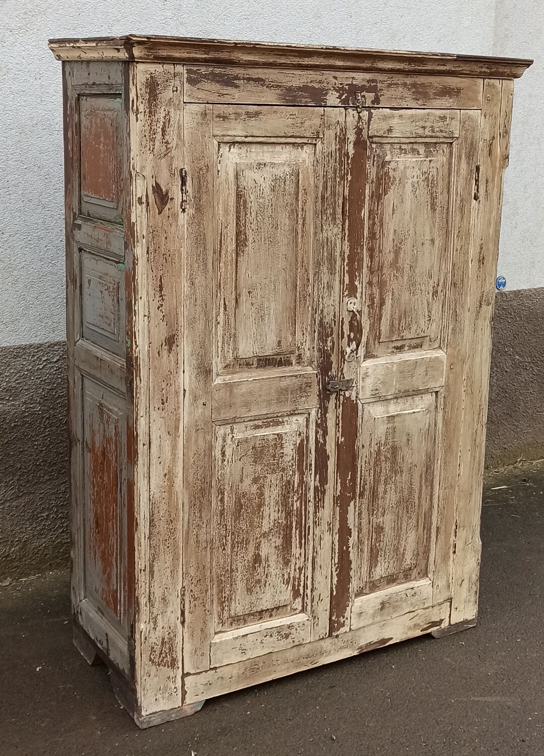 Old wooden wardrobe beige / pale yellow façade