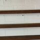 Old oak shelf back of glass counter wall