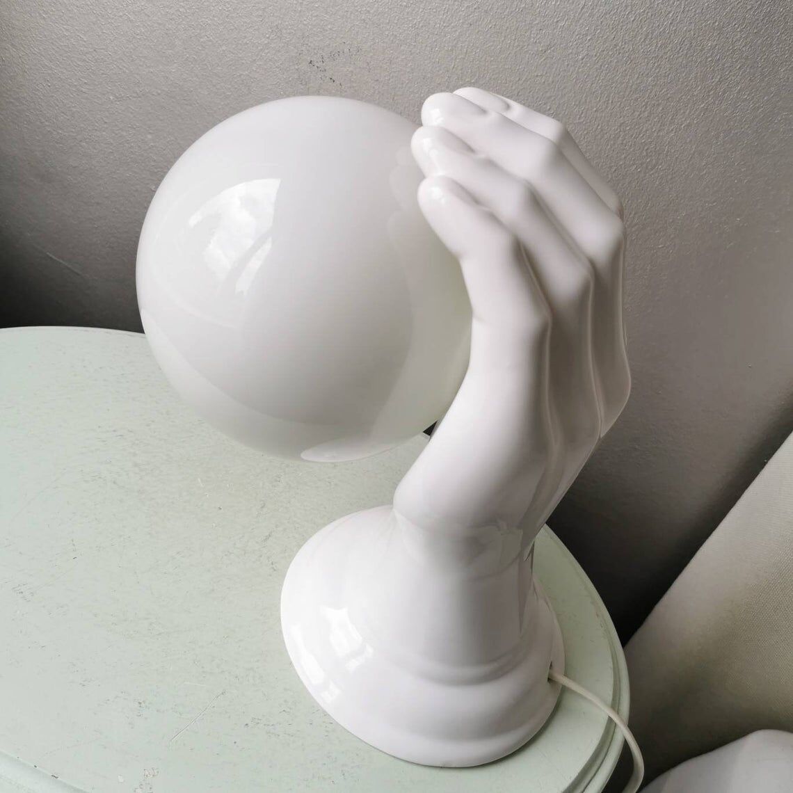 Hand-shaped ceramic wall lamp with 80s glass sphere