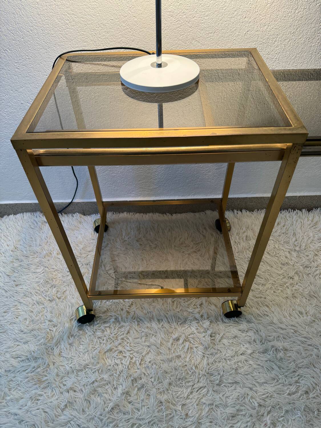 Brass rolling trolley with smoked glass from the 70s