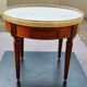 French hot water bottle table in Louis XVI style (1890); marble top and bronze gallery
