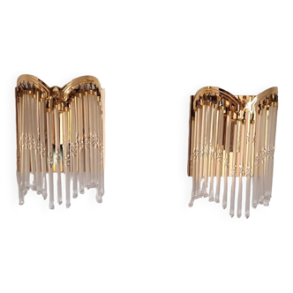 Pair of sconces in gold metal and tassels