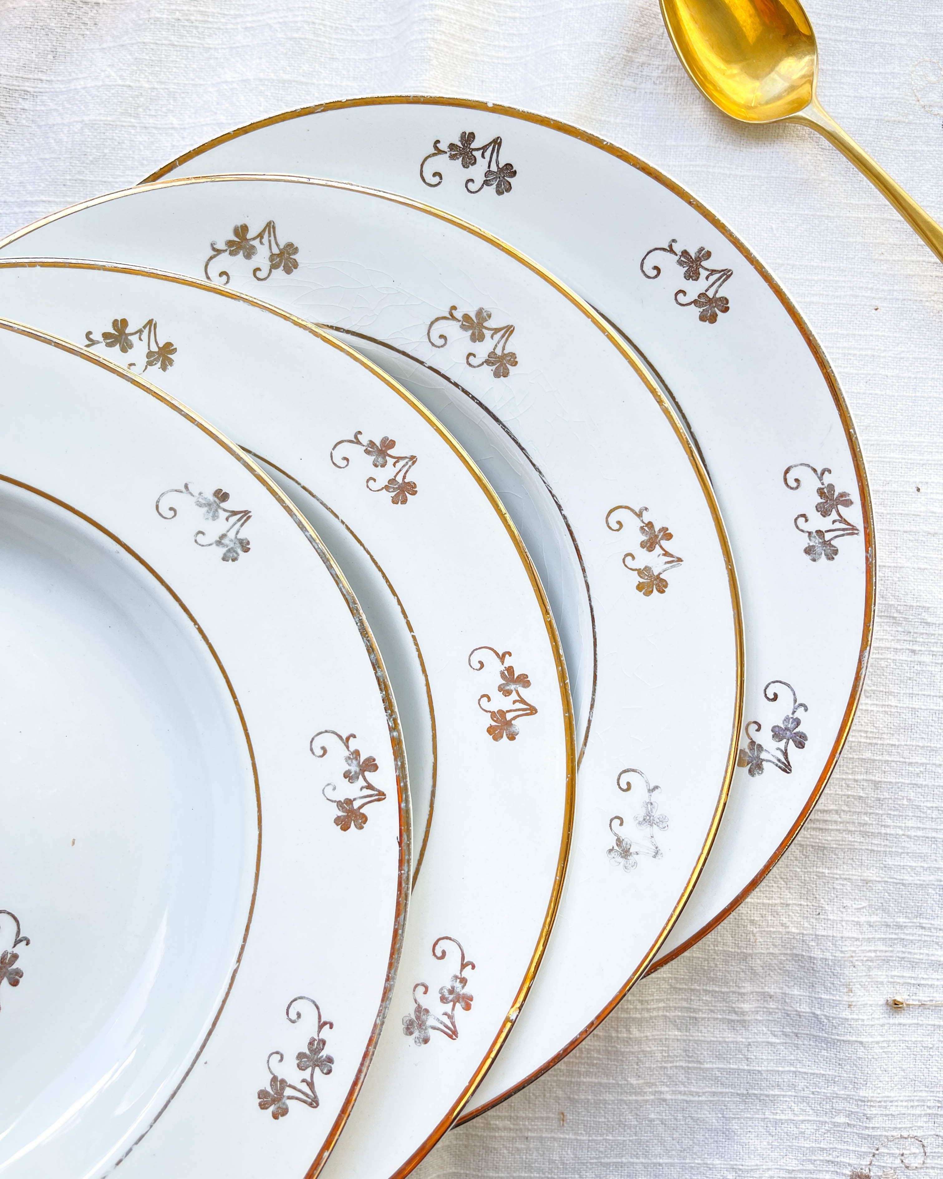 4 white porcelain L'Amandinoise soup plates with gold floral pattern