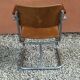 Fauteuil moderniste en multiplex, tubes acier vissés