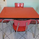 Table in red formica, 4 roc chairs, 2 extension cords, 2 drawers 60