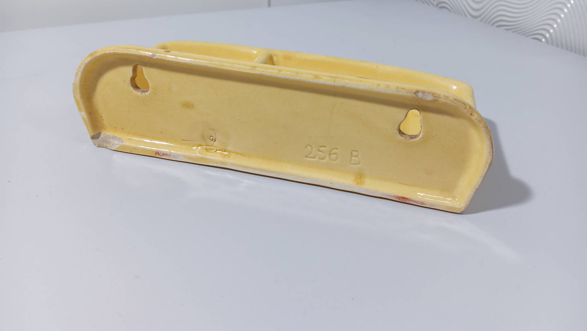 Pale yellow ceramic soap dish