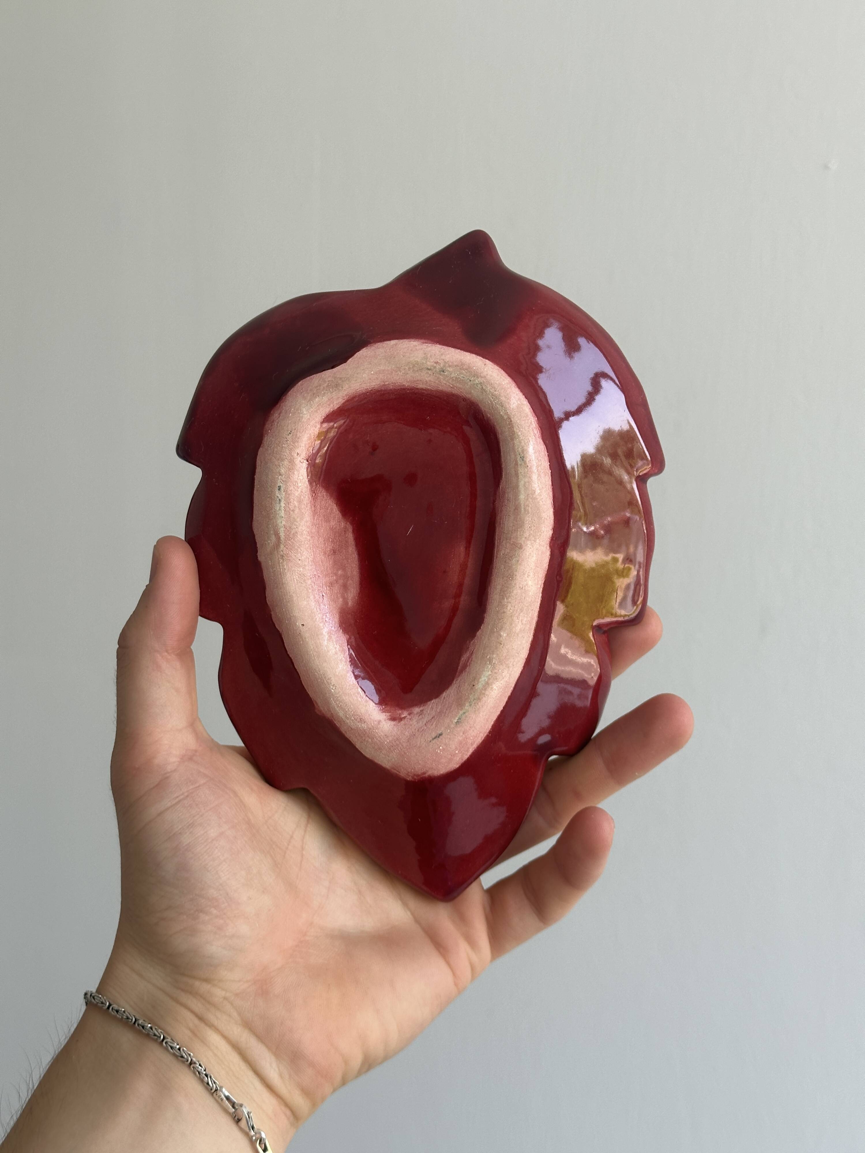 Red ceramic butter dish with knife