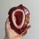 Red ceramic butter dish with knife