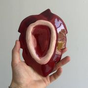 Red ceramic butter dish with knife