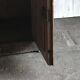 Vintage brown pine dresser with a painted top, moulded panels, and decorative locks.