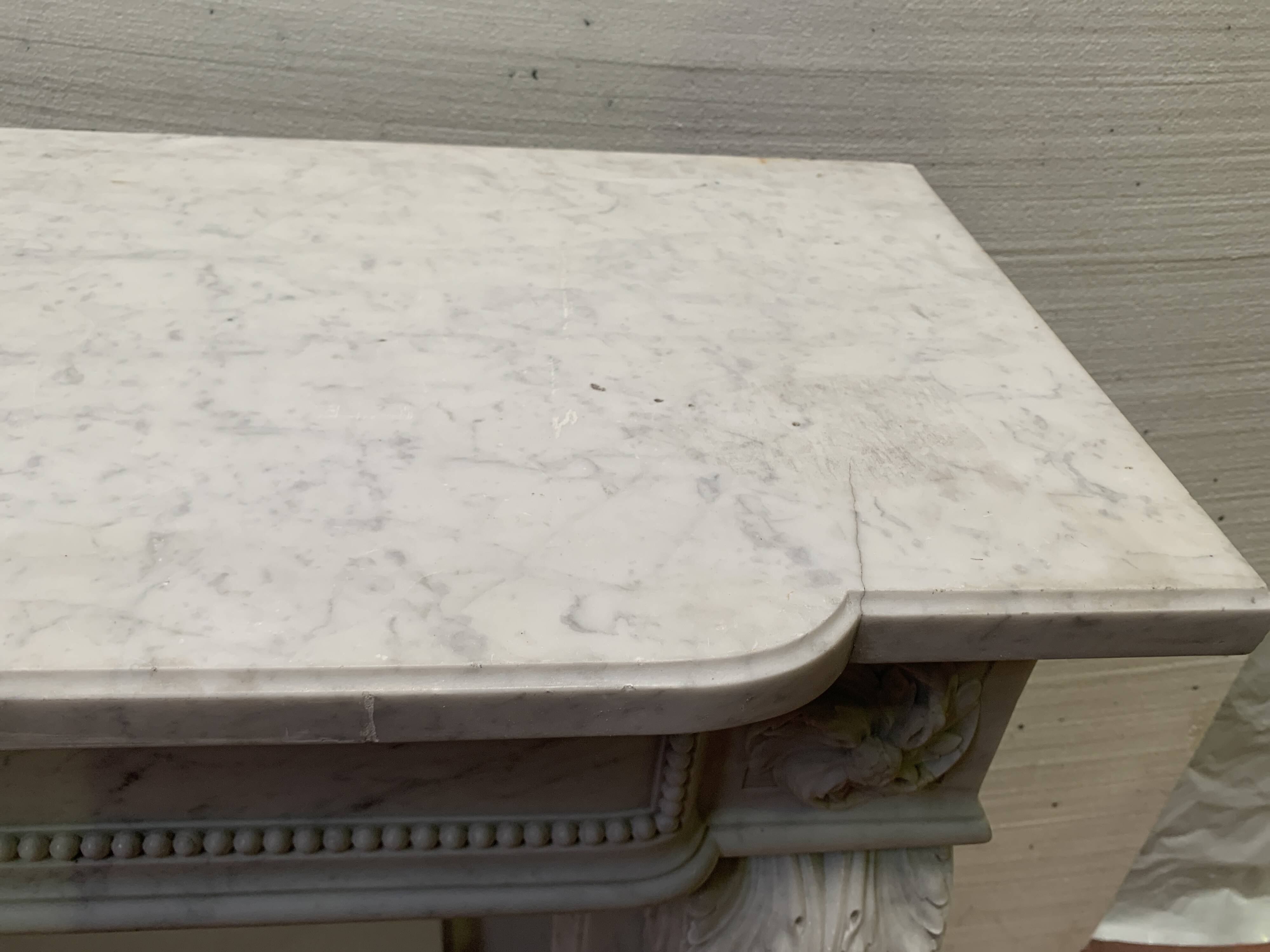 Louis XVI style fireplace in white Carrara marble, 19th century