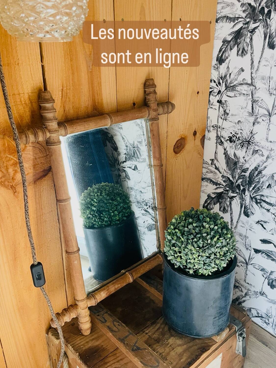 Carved wooden mirror in a bamboo style